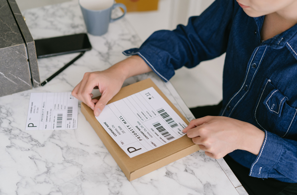 Girl prepare packing for shipping